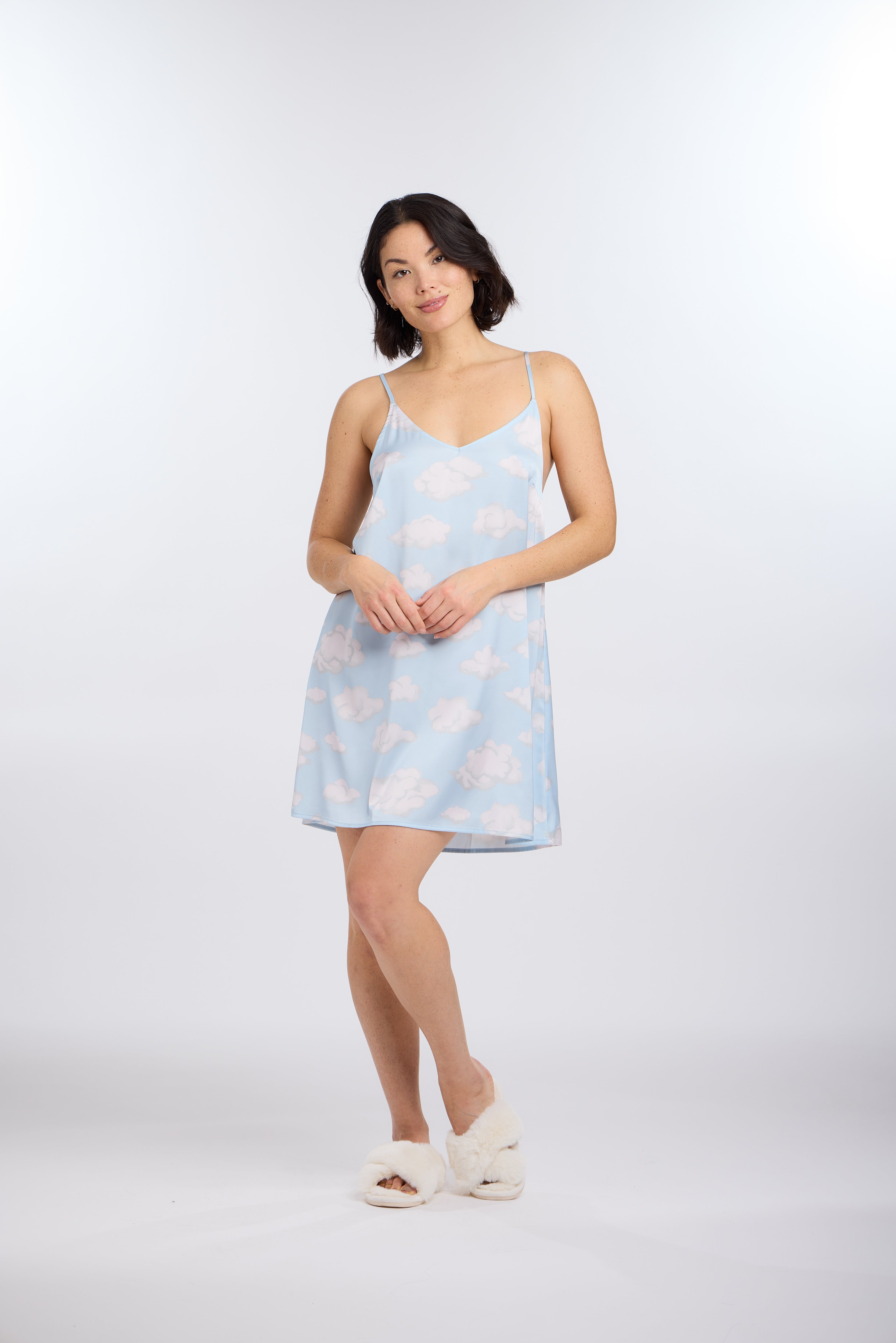 Woman wearing Cloud Nine chemise with fluffy cloud patterns on a white background
