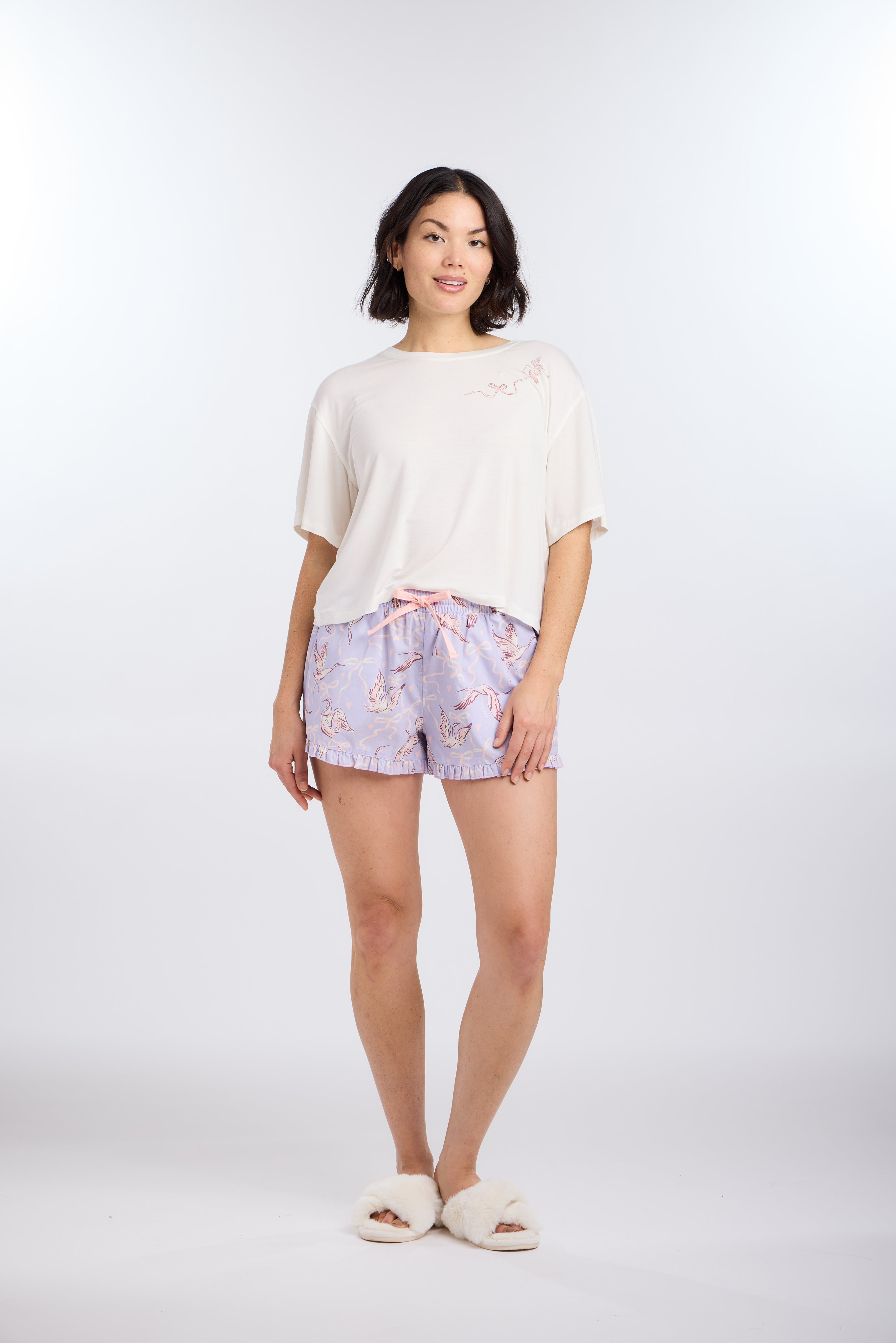Model wearing Cropped Pajama Sleep Tee with Bird & Bow Design with Birds of a Feather Sleep Shorts by Nick & Nora