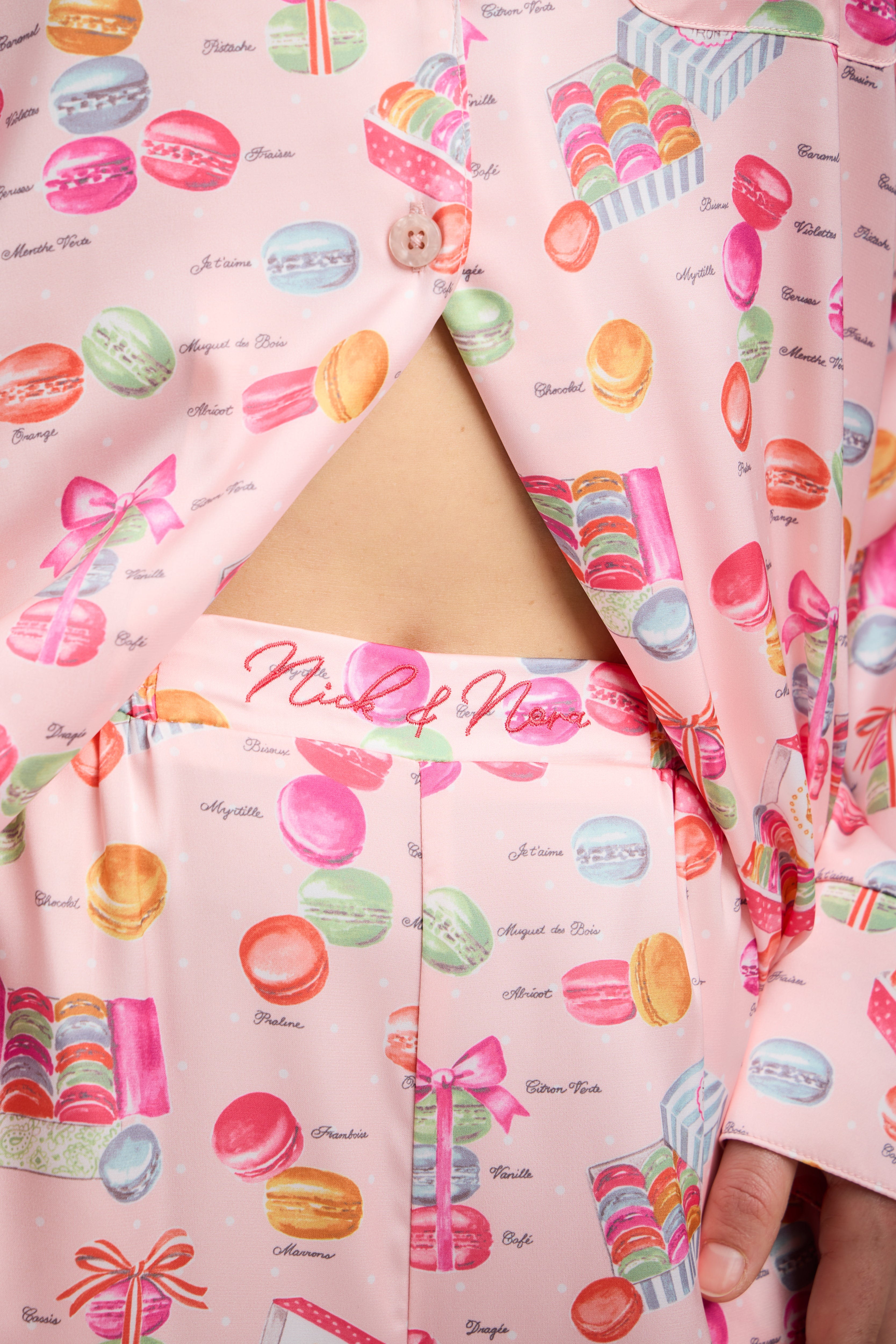 Close up studio photo of Nick & Nora embroidery on waistband on Macarons Print Pajama Set