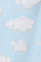 Pattern of iconic Cloud Nine print featuring fluffy white clouds on a light blue background