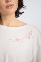 Closeup detail shot of Cropped Pajama Sleep Tee with Bird & Bow Design by Nick & Nora