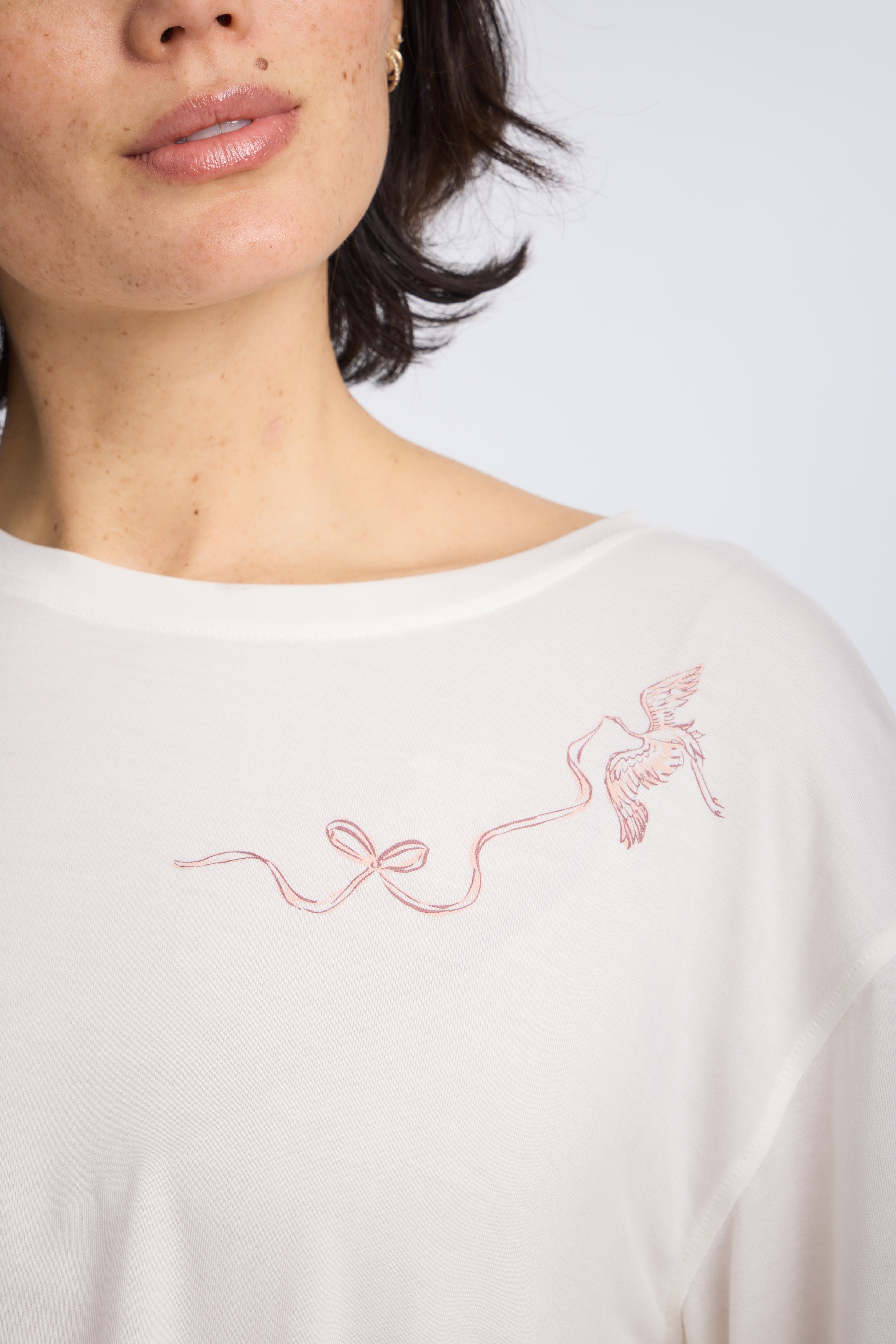 Closeup detail shot of Cropped Pajama Sleep Tee with Bird & Bow Design by Nick & Nora
