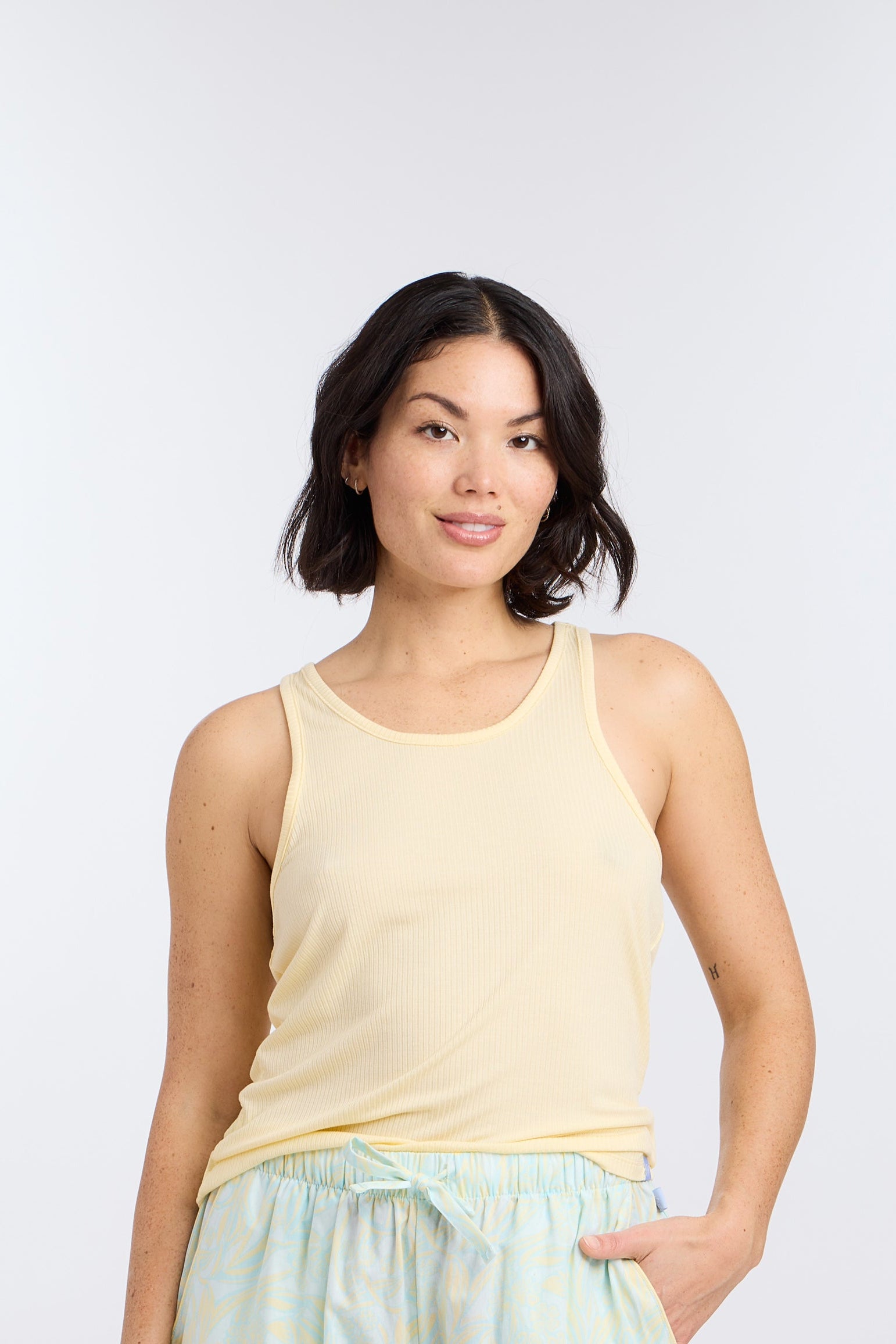 Model wearing Racerback Sleep Tank Top in Butter Yellow by Nick & Nora