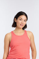 Model wearing Racerback Tank Top in Hot Coral by Nick & Nora